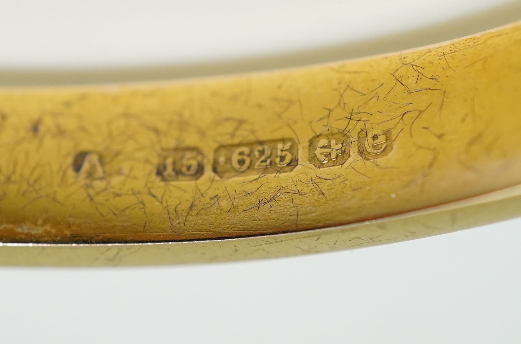 An Edwardian 15ct gold and diamond bangle, circa 1904